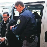 Kosto Aleksandrova so iz pripora pripeljali z lisicami na rokah in verigo na nogah