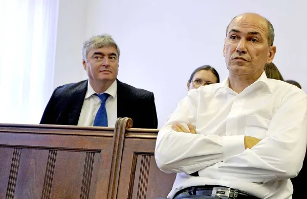 Janezu Janši  Franci Perčič kot zasebni kazenski tožilec očita žaljivo obdolžitev o sodelovanju z Udbo