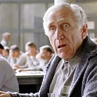 James Whitmore kot ostareli kaznjenec Brooks v Kaznilnici odrešitve