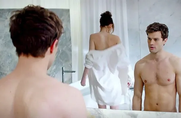 Dakota Johnson (Anastasia) in Jamie Dornan (Christian) v filmu Petdeset odtenkov sive. 
