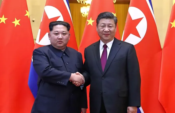 Kim Jong-un in  Xi Jinping