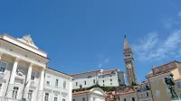 Kdo bo dominiral v dvoetažni občinski stavbi iz leta  1879  nad 
severozahodnim delom trga?
