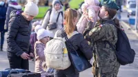 Prihod ukrajinskih beguncev v Varšavo - po petih dneh vojne v 
Ukrajini je na begu že pol milijona ljudi.  