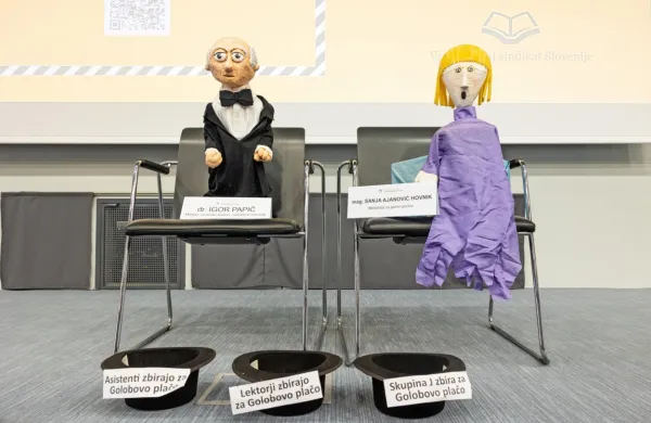 Ker ministrov ni bilo na shod, so stavkajoči na “zatožno klop” 
posedli njuni lutki. 