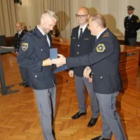 Jaka  Obid  s tolminske  policijske  postaje (levo),  na  sredini  Jože  
Senica, desno  Evgen  Govekar