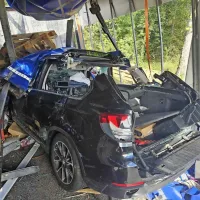 Priklopnik se je prevrnil na vozilo znamke bmw nemških registrskih tablic.