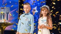 Osemletni Edvard in sedemletna Frida Kaloh in zlati lističi v oddaji 
Slovenija ima talent.