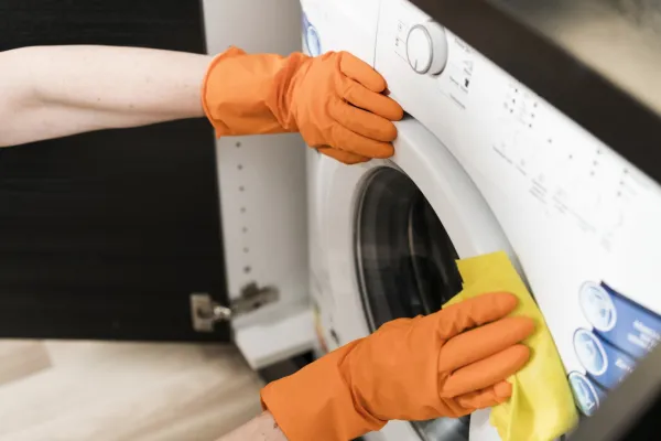 high angle woman cleaning washing machine. High resolution photo,Image: 932927406, License: Royalty-free, Restrictions:, Model Release: no, Credit line: Oleksandr Latkun/Panthermedia/Profimedia