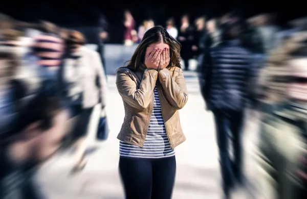 Stress, anxiety, fear or panic attack in public. Woman with mental health disorder. Phobia of crowd of people. Schizophrenia, agoraphobia or paranoia. Busy city street. Depressed introvert person.,Image: 975677883, License: Royalty-free, Restrictions:, Model Release: no, Credit line: Tero Vesalainen/Alamy/Profimedia