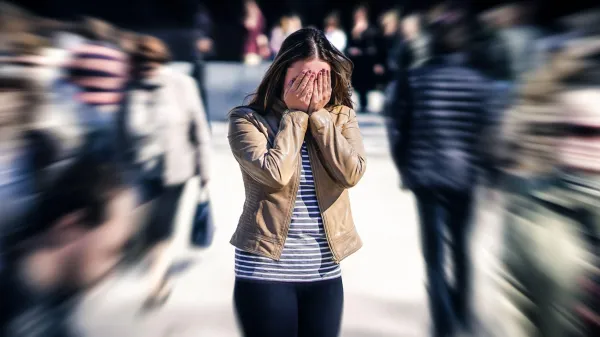 Stress, anxiety, fear or panic attack in public. Woman with mental health disorder. Phobia of crowd of people. Schizophrenia, agoraphobia or paranoia. Busy city street. Depressed introvert person.,Image: 975677883, License: Royalty-free, Restrictions:, Model Release: no, Credit line: Tero Vesalainen/Alamy/Profimedia