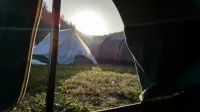 Mojstrana.Soncni vzhod iz sotora.