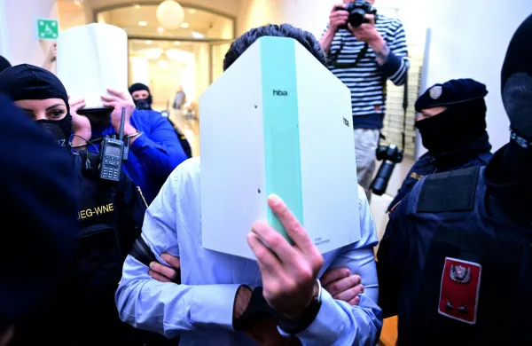 Two defendants in handcuffs are escorted to the courtroom by justice officers as a trial starts at court in Wiener Neustadt, Austria, on April 28, 2026, over a plot to attack a Taylor Swift concert in Vienna. The main suspect, who has been in detention since his arrest in August 2024, is facing terror offenses and other charges, prosecutors said.,Image: 1094948995, License: Rights-managed, Restrictions: Austria OUTSOUTH TYROL OUT, Model Release: no, Credit line: ROLAND SCHLAGER/AFP/Profimedia