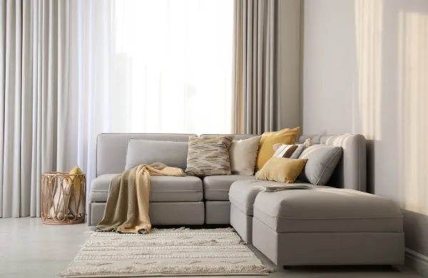 Living room interior with large grey sofa