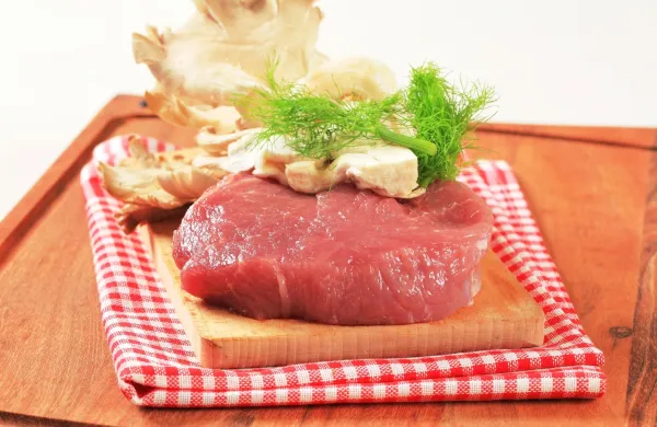 Raw red meat and oyster mushrooms on a cutting board,Image: 225730191, License: Rights-managed, Restrictions:, Model Release: no, Credit line: -/Digifoodstock/Profimedia