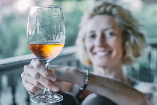 Portrait of a mature caucasian blonde young woman in her 50s enjoying a glass of wine on the porch of a house. Lifestyle concept.,Image: 962578929, License: Rights-managed, Restrictions: Model Released, Model Release: yes, Credit line: Mikel Bilbao/VWPics/Profimedia