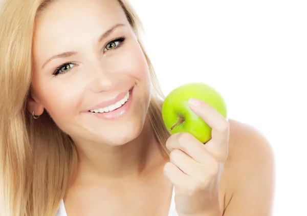 Happy woman dieting, pretty girl eating apple, female hand holding green fruit, healthy lifestyle, nutritious organic food, isolated on white background with text space,Image: 108307451, License: Royalty-free, Restrictions:, Model Release: yes, Credit line: Anna Omelchenko/Alamy/Profimedia