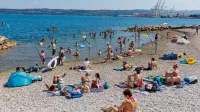 Koper, 21.6.2026Turizem, Poletje, Vročina, poletni utrip v Kopru,kopalci, plaža, sprehajalci