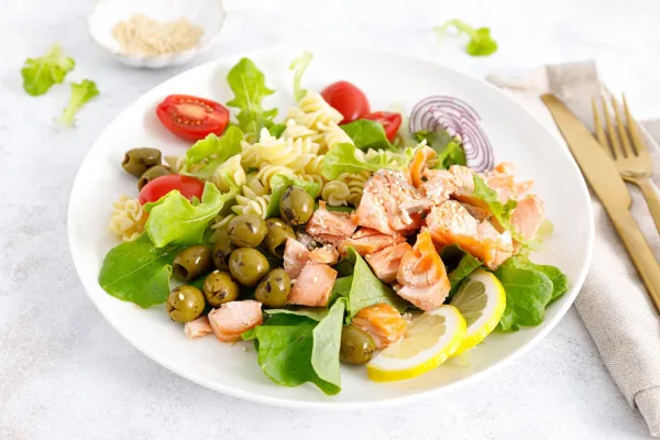 Grilled salmon salad with fresh lettuce, tomatoes, green olives, red onion and pasta. Healthy food, diet,Image: 1132018098, License: Royalty-free, Restrictions:, Model Release: no, Credit line: -/Ingram/Profimedia
