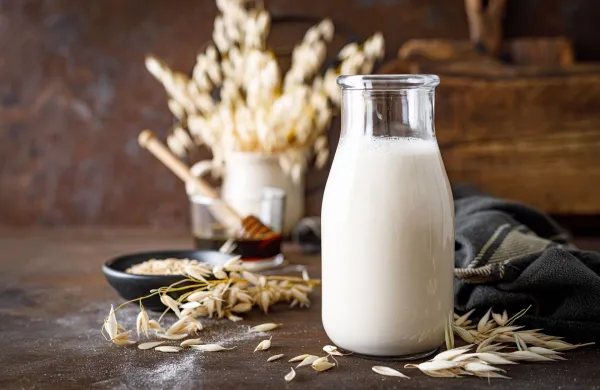 Vegan oat milk in glass bottle and ingredients for cooking. Healthy vegetarian non-dairy drink or beverage. Alternative milk,Image: 744003710, License: Royalty-free, Restrictions:, Model Release: no, Credit line: -/Ingram/Profimedia