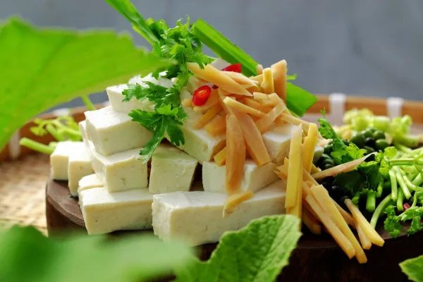 Raw material for fried tofu cook with sauce and ginger, pepper, close up slice of white tofu and spice ready to cook on wooden cutting board, simple homemade vegan food,Image: 1139733463, License: Royalty-free, Restrictions:, Model Release: no, Credit line: -/Ingram/Profimedia