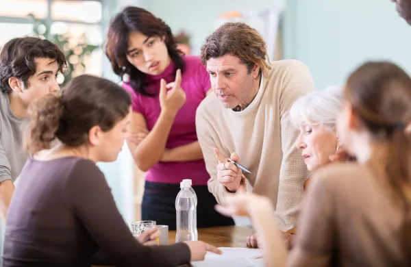 Focused men and women of different ages actively communicating and sharing ideas at table,Image: 1084342770, License: Royalty-free, Restrictions:, Model Release: no, Credit line: Iakov Filimonov/Alamy/Profimedia