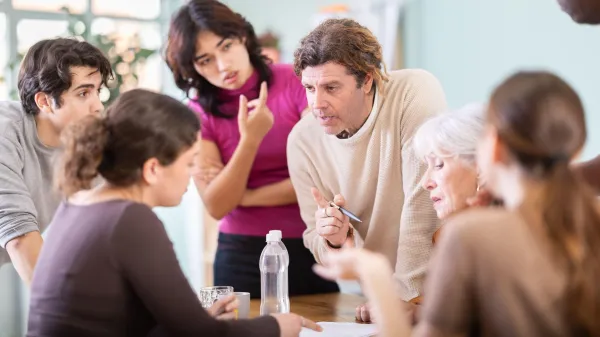 Focused men and women of different ages actively communicating and sharing ideas at table,Image: 1084342770, License: Royalty-free, Restrictions:, Model Release: no, Credit line: Iakov Filimonov/Alamy/Profimedia